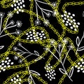 Floral ornament and white dots on a dark colored background with golden chains